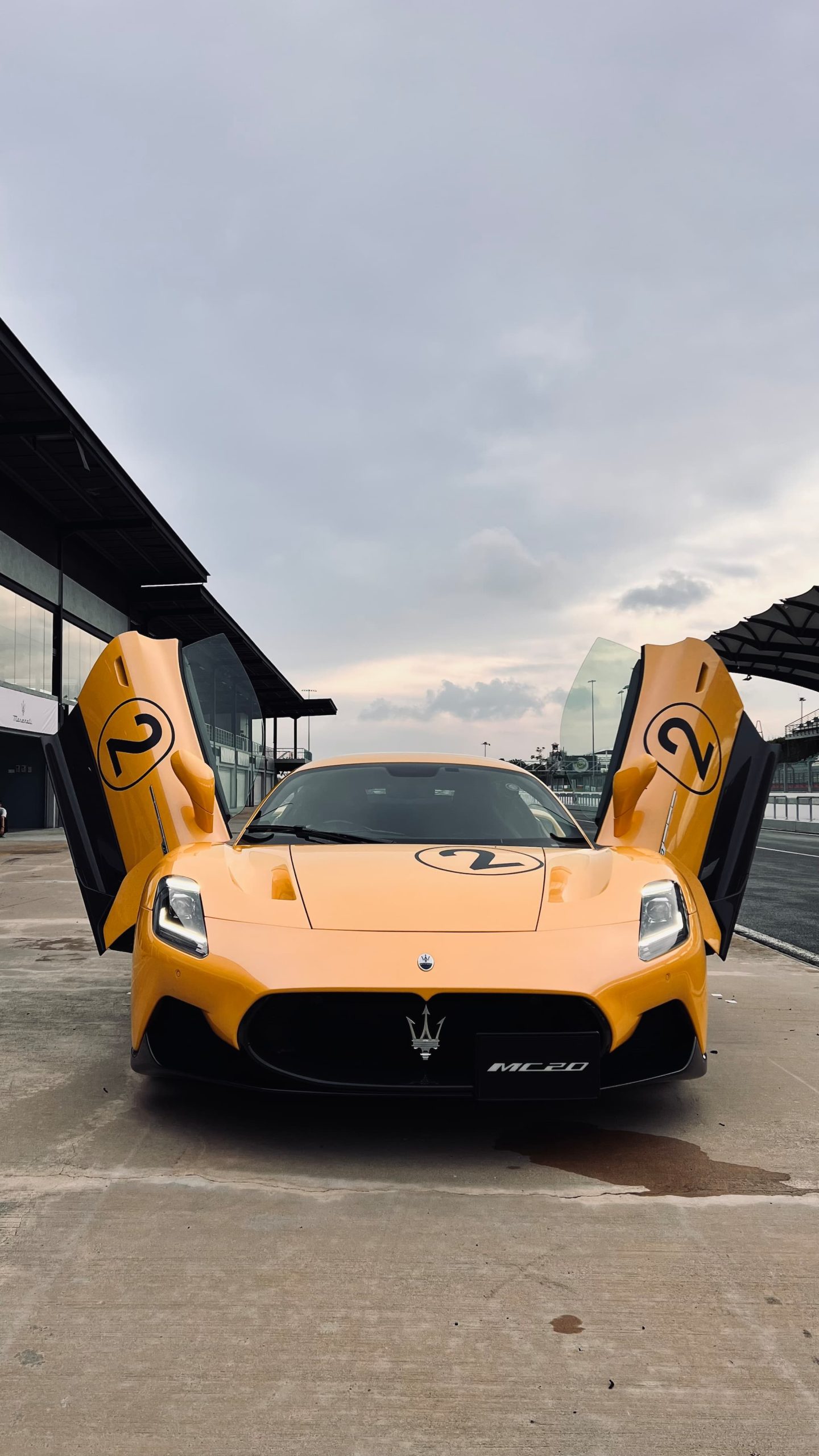 With its butterfly doors up, and an eye-popping shade of yellow reflecting off Sepang’s freshly rained-upon tarmac, the MC20 is a vision (Image Source: Parth Charan/Moneycontrol)